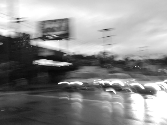 A sureal photo for a surreal moment at this intersection, sitting in my 1968 Plymouth Barracuda convertible waiting to turn left onto Sunset Blvd.  A beautiful young woman, early 20s in a tight black dress, black fishnets and mile high heels crossed the street in front of me with her friend.  She was looking at my car, then looked over her left shoulder to smile at me as she passed.